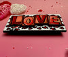 Textured Love blocks with red leopard print