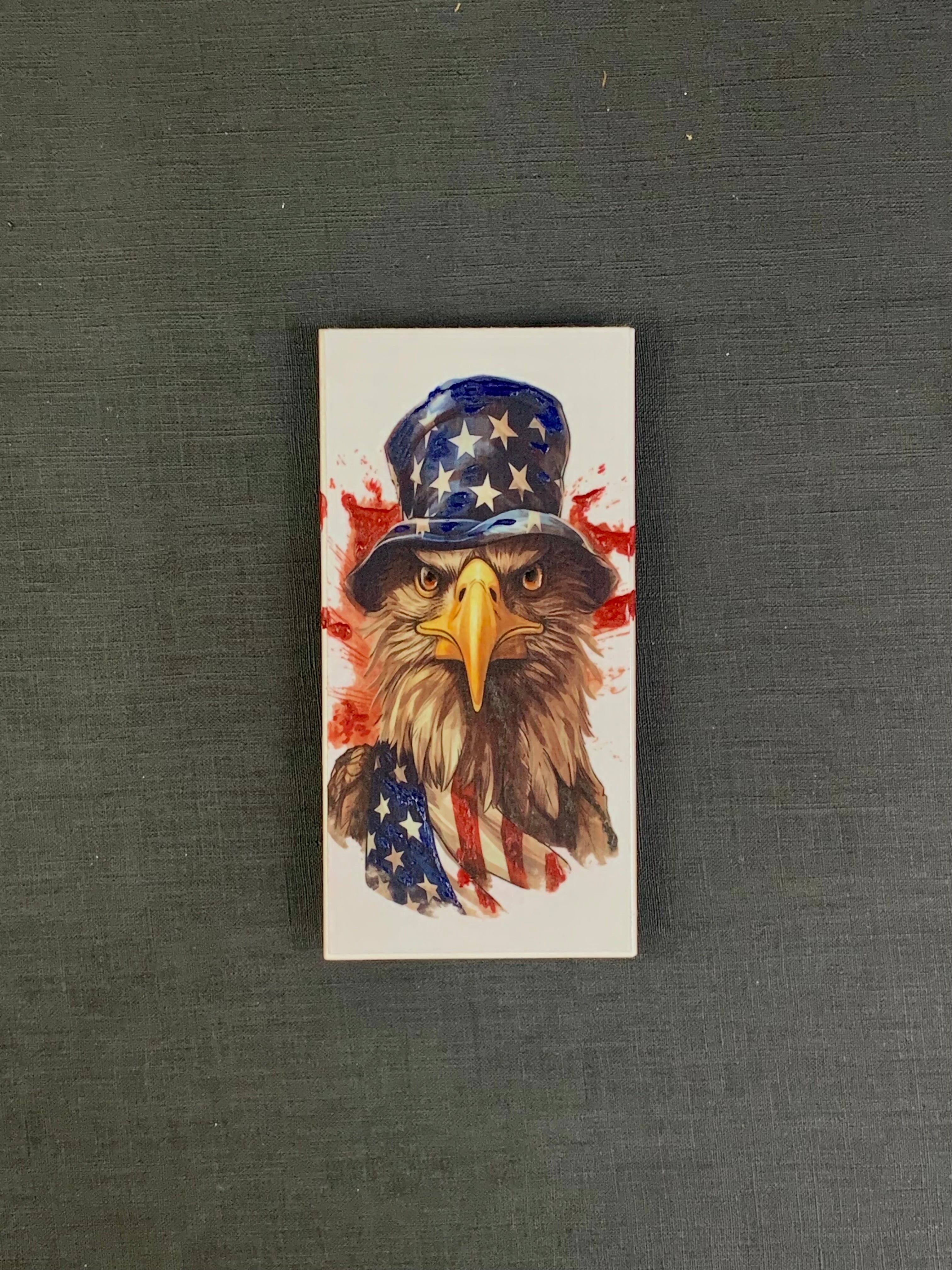 Bald Eagle with American flag and hat