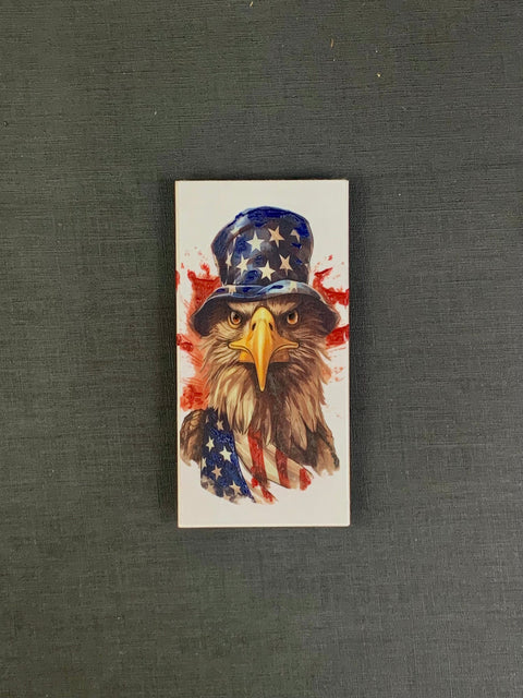 Bald Eagle with American flag and hat