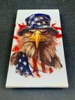 Bald Eagle with American flag and hat