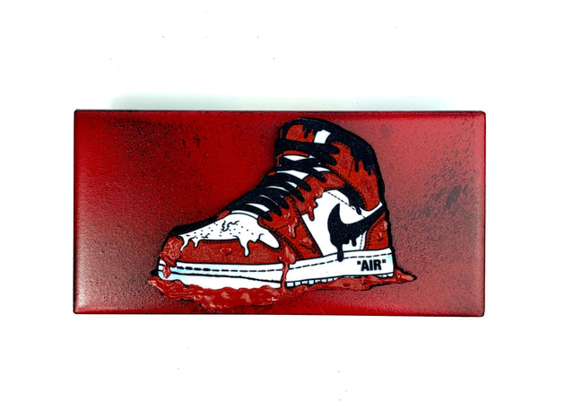 Dripping Nike red ,white and black on red ceramic tile